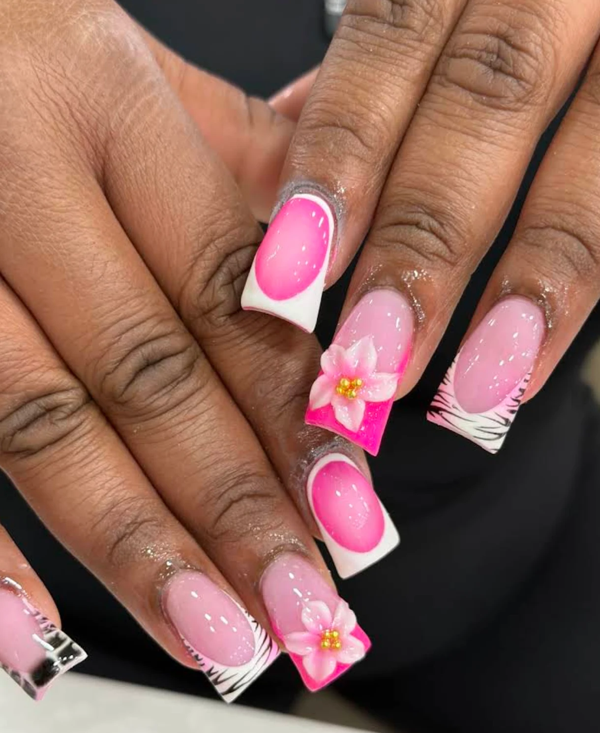 Pink and white square nails with raised flowers and zebra accents